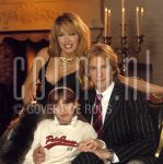 11-01-2003 Familie Paay Curry Patricia Paay, Adam Curry and Christina at home in Belgium. January 11, 2003.

[keywords]Posed, Smiling, Candles[/keywords]